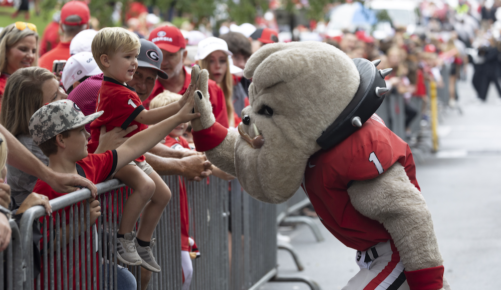 Hairy Dawg giving a young fan a high five